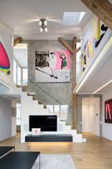 Living Room, Coffee Tables, Ceiling Lighting, Wall Lighting, Medium Hardwood Floor, and Track Lighting  Photo 1 of 27 in Art Maisonette in Letná by esté architekti