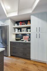 This niche in the kitchen was a perfect place to display vintage collections and art pottery. 