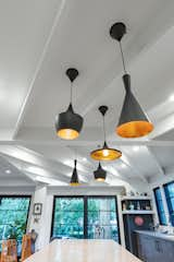 Detail shot kitchen island pendants and ceiling beams. 