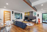 The family room with exposed beam and new fireplace/media center. 