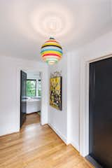 Detail shot of the hallway leading into the master suite. Complete with vintage light fixture. 