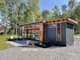 Exterior, Shipping Container Building Type, Metal Roof Material, Wood Siding Material, and Metal Siding Material The center was extended from 8’ to 12’ wide  Photo 6 of 7 in Modern Shipping Container House by Andrea Nentwick