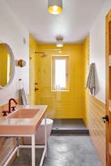 Bath Room, One Piece Toilet, Pedestal Sink, Ceiling Lighting, Accent Lighting, Open Shower, Ceramic Tile Wall, and Concrete Floor The ground floor bathroom is an explosion of bright, warm colors. 
  My Photos