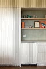 Coffee nook with mini-fridge and integral storage.