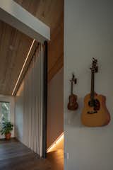 Stair with operable slat wall.