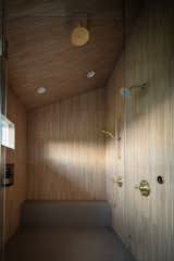 Shower in Primary Bedroom ensuite addition with tiles to match adjacent ceilings.