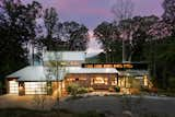 Exterior, Wood Siding Material, Shed RoofLine, House Building Type, Gable RoofLine, Metal Roof Material, and Stone Siding Material Elk Mountain Ridge Front Elevation Twilight #2  Photo 2 of 26 in Elk Mountain Ridge by Robi Eckley