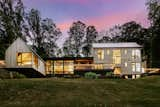 Exterior, Wood Siding Material, Shed RoofLine, A-Frame RoofLine, House Building Type, and Metal Roof Material Elk Mountain Ridge Rear Elevation Twilight   Photo 4 of 26 in Elk Mountain Ridge by Robi Eckley