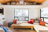 Living room with custom furniture to best accomodate studio footprint