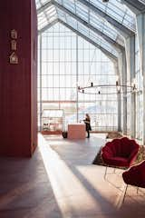 The home of architect Margit-Kristine Solibakke Klev and her husband, Arnstein Norheim,
is built inside an enormous greenhouse. The furnishings set amid the planting beds—including the Winnipeg armchairs and Royal pendant, all from Jotex—further blur the boundaries between interior and exterior. “I chose the light fixture because it’s simple and elegant, and, of course, I wanted something really big in the greenhouse space,” says Margit.