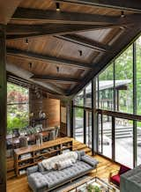 Living Room, Medium Hardwood Floor, Pendant Lighting, Bookcase, Shelves, Sofa, Chair, and Coffee Tables  Photo 17 of 30 in August Moon by SPAN Architecture