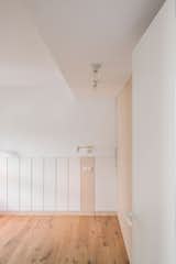 Bedroom, Medium Hardwood Floor, Wall Lighting, and Ceiling Lighting  Photo 4 of 22 in M01 by MINIMO