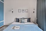 other bedroom is designed to keep the future perspective and changes in the family pattern in upcoming years. The play of white and blue is rooted in a colour palette as a future kids room. Similar to the other room the arched shape shelf breaks the rigid geometrical play depicting the fluxional nature of the kid. 