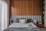 The master bedroom has also imbibed a similar theme with meticulous details of furniture. The mirror here works as a piece of aesthetic that breaks the geometrical barriers and the flow of defined lines in the space.
