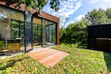 The home’s upper level includes a living roof, which can be accessed through a glazed doorway.  Photo 9 of 13 in A Restored Midcentury With an 1,800-Square-Foot Addition Seeks $740K in Illinois from Contemporary Mid Century