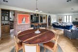 Dining Room, Chair, Accent Lighting, Bar, Medium Hardwood Floor, Recessed Lighting, and Table  Photo 6 of 18 in Rigorvive House by John Wingfelder Architect