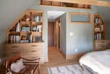 Bedroom, Medium Hardwood Floor, Ceiling Lighting, Bookcase, Storage, and Shelves  Photo 8 of 18 in Rigorvive House by John Wingfelder Architect