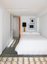 Alastair Standing designed bedframes for the two lofted rooms, which were built with lights affixed to the bottom that shine down onto the ground floor.  Photo 9 of 11 in A Loftlike SoHo Apartment With Glass Block Floors Could Be Yours for $2.35M