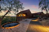 A soaking tub set off to the side of the house offers a tranquil space to view the sunset.