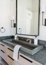 Warm hues are complimented by cooler materials, including Native Trail's Trough Sink.