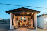 Dining al fresco experience with a TV for your entertainment.