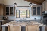 Kitchen, Quartzite Counter, Mosaic Tile Backsplashe, Wood Cabinet, Ceiling Lighting, Wall Oven, and Pendant Lighting  Photo 3 of 10 in Perfect Ski Getaway: Somrak Concept + Structure’s Crested Butte Home by Grace Gathright
