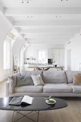 Living Room, Sofa, Coffee Tables, Medium Hardwood Floor, Recessed Lighting, and Ceiling Lighting Architectural details   Photo 5 of 12 in Milan High Ceilings by Olivia Wong