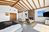 900 Sq Foot Primary Bedroom with tremendous beams