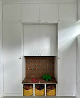 Mud room - new cabinetry with peg board detail