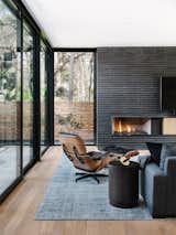 Detail of steel/brick and oak fireplace designed by McCarty