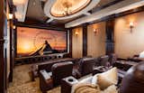 An upper-level bonus room houses a luxe “4D” professional theater with enormous screen, supreme sound quality, the finest finishes and tiered leather seating for 12+