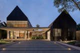 Exterior, House Building Type, Tile Roof Material, A-Frame RoofLine, and Wood Siding Material Front View from Carport  Photo 2 of 64 in Halo House by TAMARA WIBOWO ARCHITECTS INDONESIA