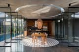 Dining Room, Concrete Floor, Pendant Lighting, Chair, Table, and Lamps Dining Area  Photo 18 of 64 in Halo House by TAMARA WIBOWO ARCHITECTS INDONESIA