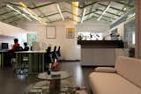 The concept of retreat like ambience is carried forward to the workstation area with green coloured criss cross rafters complimented with green colour workstation base.