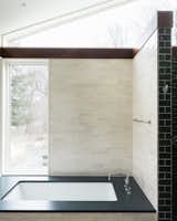 Bath Room, Undermount Tub, Ceramic Tile Wall, Open Shower, Ceramic Tile Floor, and Engineered Quartz Counter A bather can view the wetlands easily.  Wheat and green Zellige tile are from Zia.  Photo 8 of 10 in Ground House by Eve Isenberg