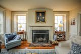 Living Room, Wood Burning Fireplace, Sofa, End Tables, Lamps, Chair, Medium Hardwood Floor, and Table Lighting Sitting Room/Parlour Fireplace  Photo 4 of 17 in The Betsy Searle Place by Sadie Halliday