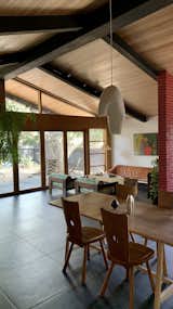 Snapshot of main space through dining into living areas, Ren Ceramics on table, Doug Johnston pendant