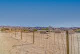 Ranch fence made with wire and California vineyard posts