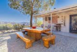 Outdoor, Desert, Landscape Lighting, Side Yard, Concrete Patio, Porch, Deck, Wood Patio, Porch, Deck, Shrubs, Boulders, Large Patio, Porch, Deck, and Trees Handmade teak table and chairs seating for 10  Photo 12 of 14 in Rancho Contento by Dori from Rancho Contento
