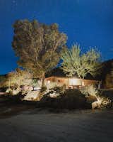Outdoor, Boulders, Stone Fences, Wall, Desert, Decomposed Granite Patio, Porch, Deck, Retaining Fences, Wall, and Concrete Patio, Porch, Deck Ranch house beneath the desert night sky  Photo 13 of 14 in Rancho Contento by Dori from Rancho Contento