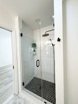 Bath Room, Porcelain Tile Floor, Enclosed Shower, Drop In Sink, and Subway Tile Wall Renovated Main Floor Bathroom  Photo 14 of 15 in The Baldwin House by Temescal Creative