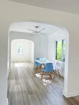 Living Room, Chair, Ceiling Lighting, and Light Hardwood Floor Breakfast nook view into entryway   Photo 11 of 15 in The Baldwin House by Temescal Creative