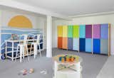 Custom rainbow cabinetry by designer Martine Ilana accents the kids' playroom.