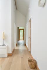 Hallway and Light Hardwood Floor  Photo 13 of 16 in Olive Passive House by DEMO Architects