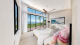 Bedroom A rendered view of a bedroom with framed ocean views  Photo 5 of 14 in The Butterfly House: A Modern Home on Kauai's North Shore Asks $12.5 Million by Luxury Design