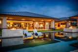 Outdoor, Back Yard, and Infinity Pools, Tubs, Shower The home by evening light, featuring two outdoor fire pits.   Photo 8 of 8 in Hokulia’s 81-6575 Hia Ai Ono Place by Luxury Design