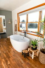 Freestanding soaking tub with views of the Catskill mountains.