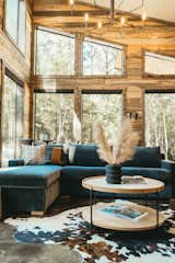 Large tall windows brings endless views of the piney forest.