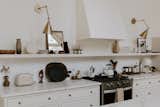 Fully equipped and carefully curated kitchen, featuring ceramic dishes, handmade wooden bowls, vintage glassware, SMEG appliances, Italian Bialetti Moka Pot, and antiques personally collected from trips to Rome, Paris, and Mexico City.
