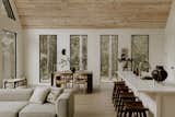 Open floor plan with windows wrapping around the entire cabin, bringing the inside in.